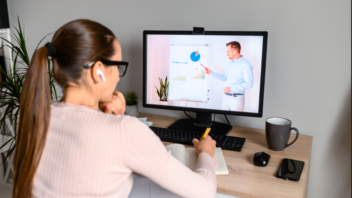 woman watching presentation on computer