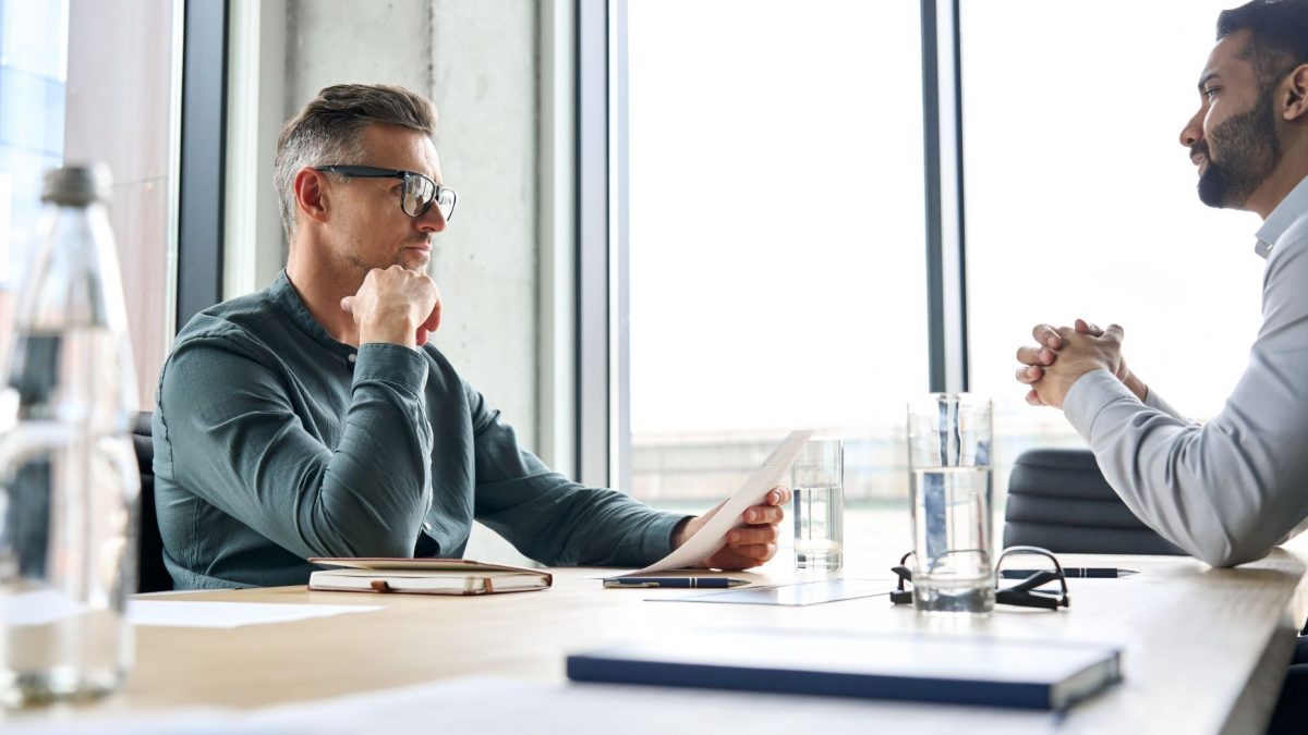 two men discussing progressive discipline