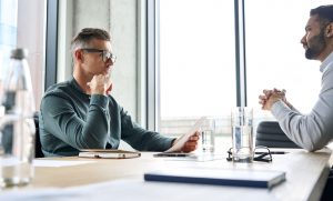 two men discussing progressive discipline
